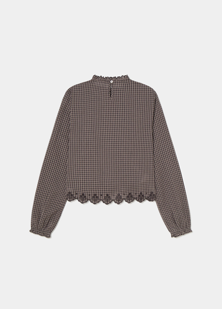 Blusa a quadri con orlo ricamato
