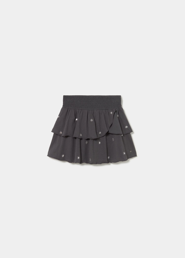 Falda smock de color gris oscuro con bordados y diseño de volantes superpuestos