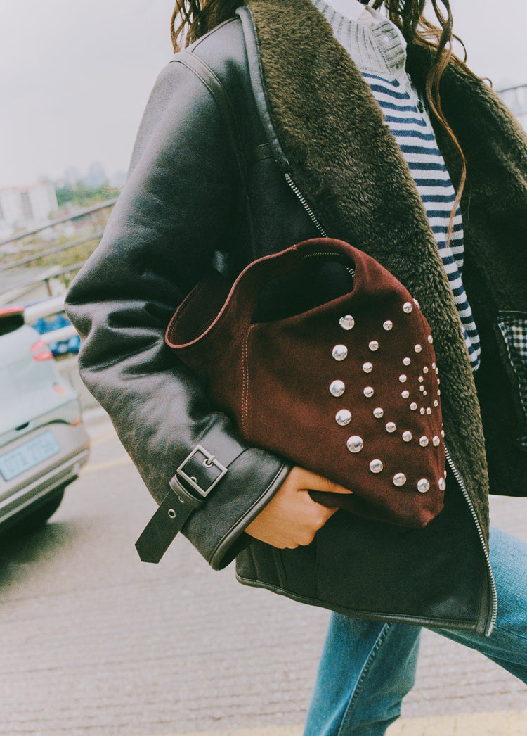 Shoulder bag with spiral studs