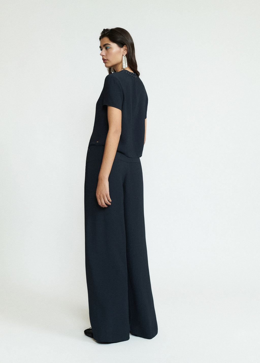 Pantaloni lunghi con borchie