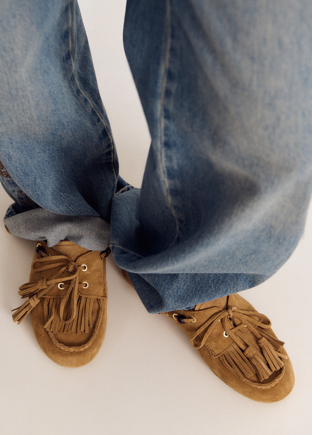 Mules mocassí amb borles de cuir