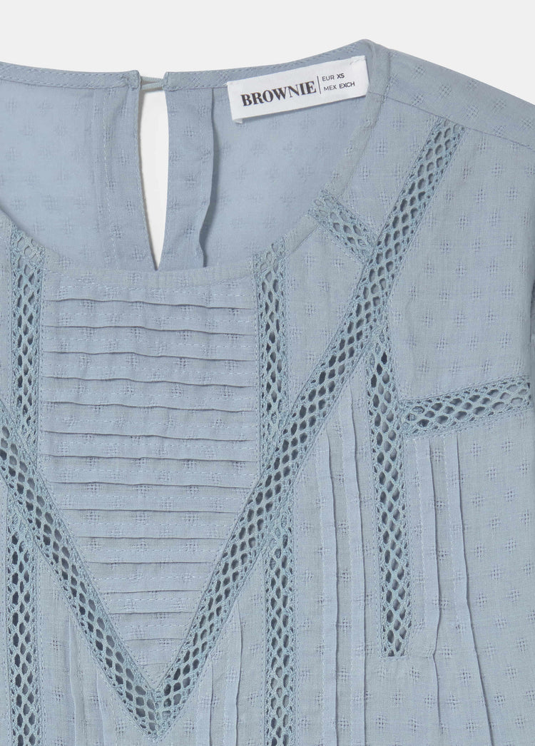 Blouse with lace and a high neckline