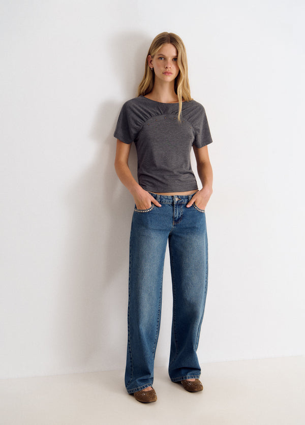 Jeans tachas cruz
