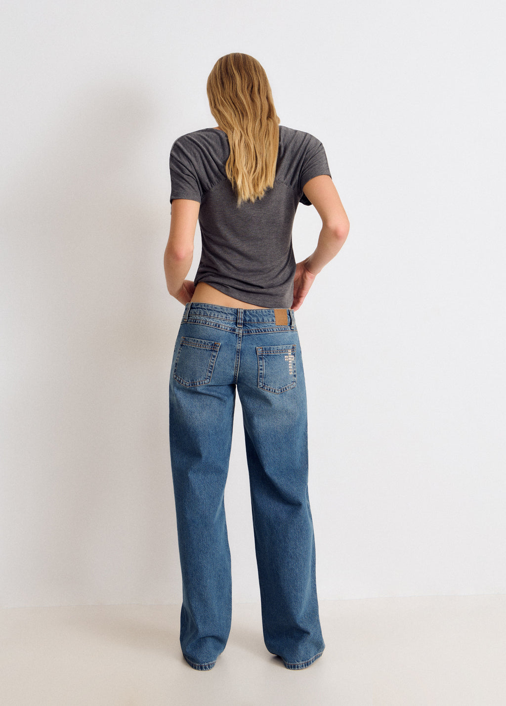Jeans tachas cruz