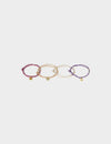 Set mit Armbändern, Perlen und Charms