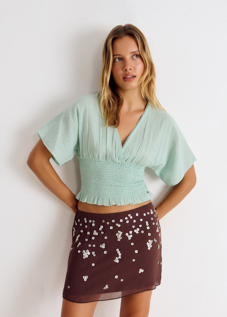 Embroidered smocked blouse