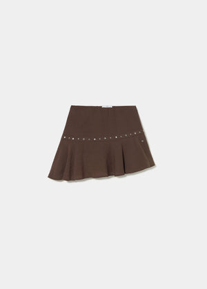 Short skirt with asymmetrical hem and studs
