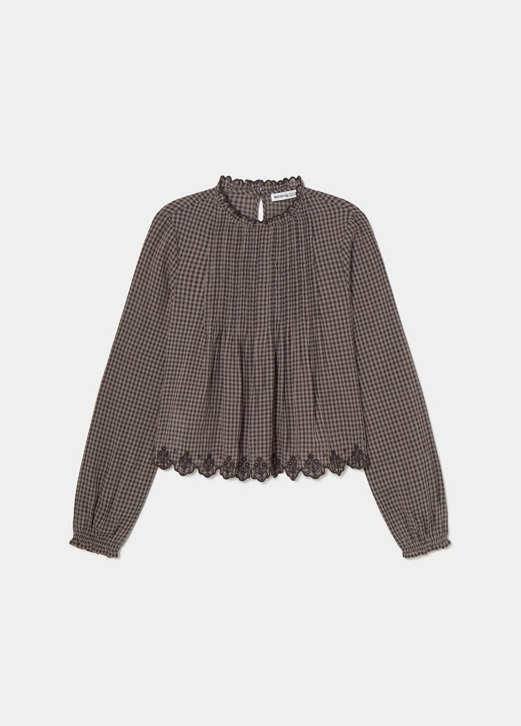 Plaid blouse with embroidered hem