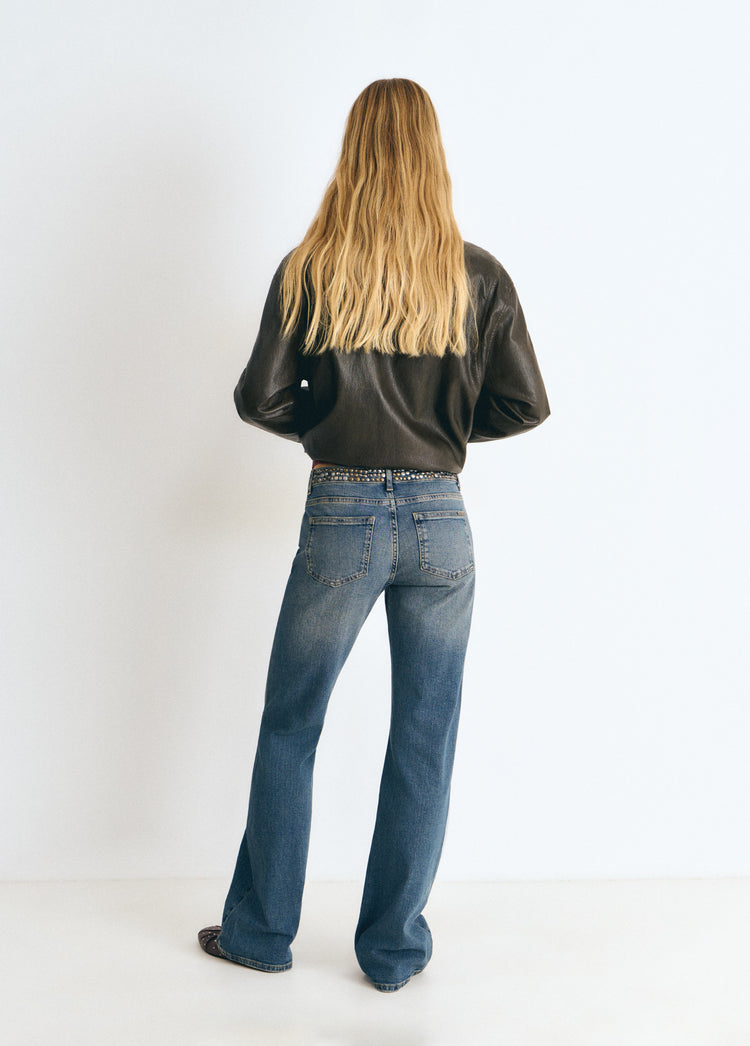 Jeans con borchie e vita alta