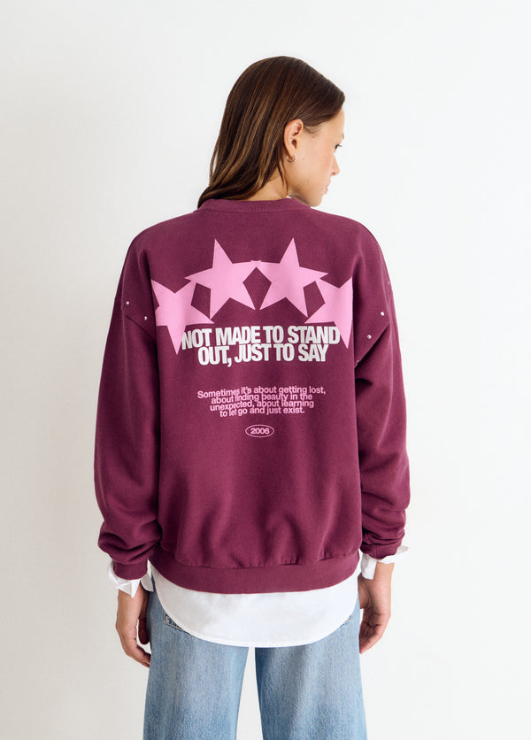 Sudadera print estrellas tachas