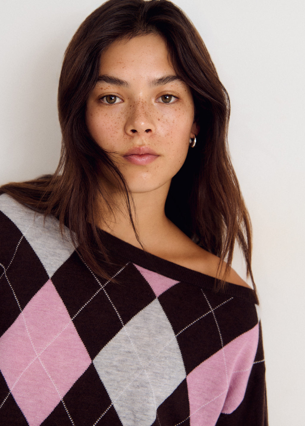 Asymmetrical diamond-patterned sweater