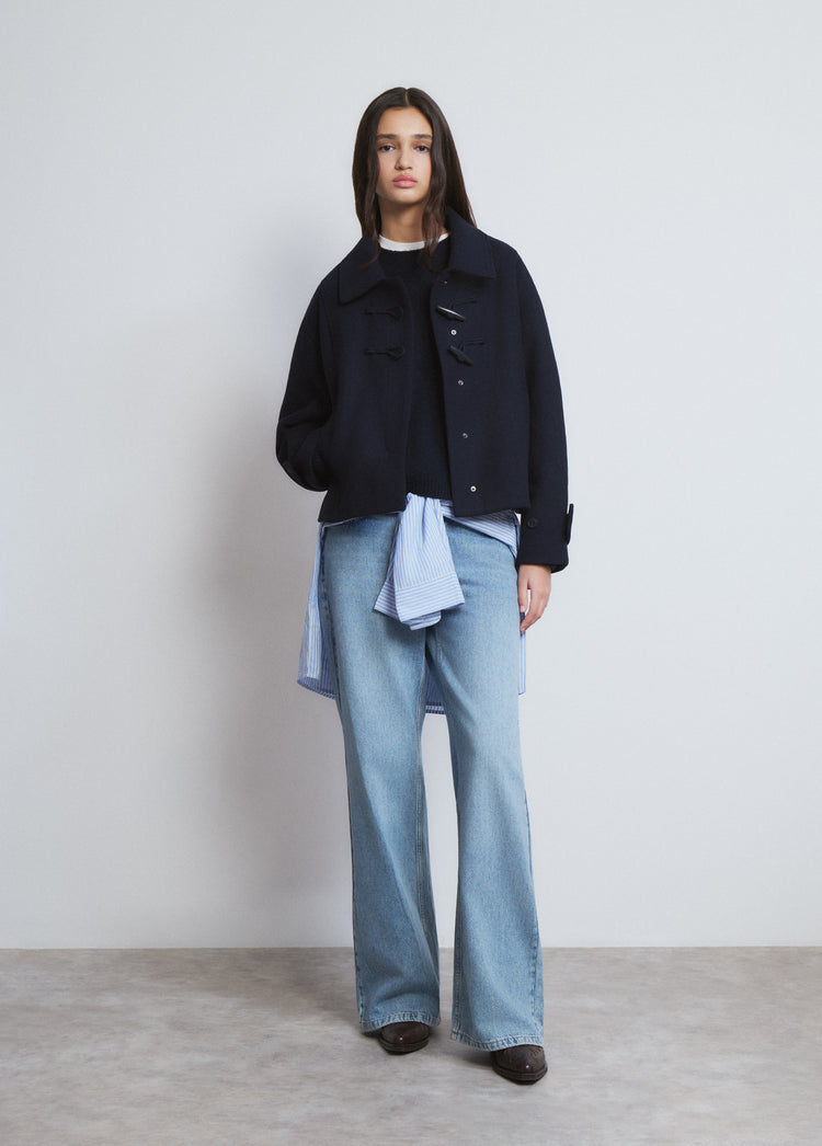 Short coat with toggle fastenings