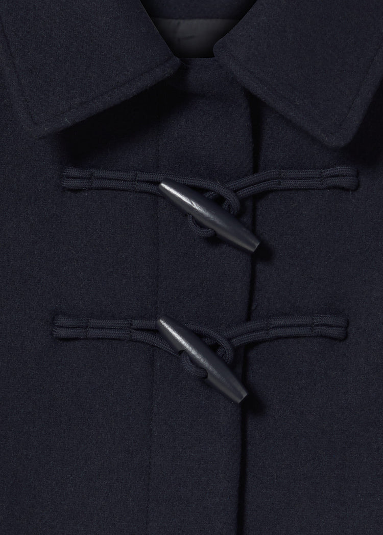 Short coat with toggle fastenings