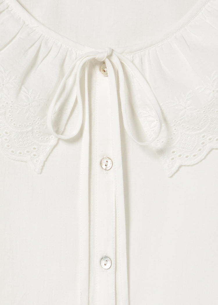 Blusa ricamata con fiocco