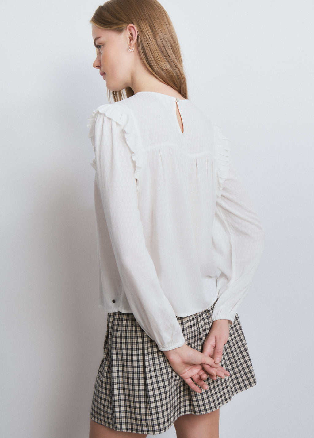 Ruffle blouse with studs