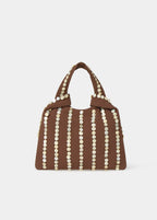 Bolso pequeño de mano en chocolate con tiras de nácar y asa sobre el hombro
