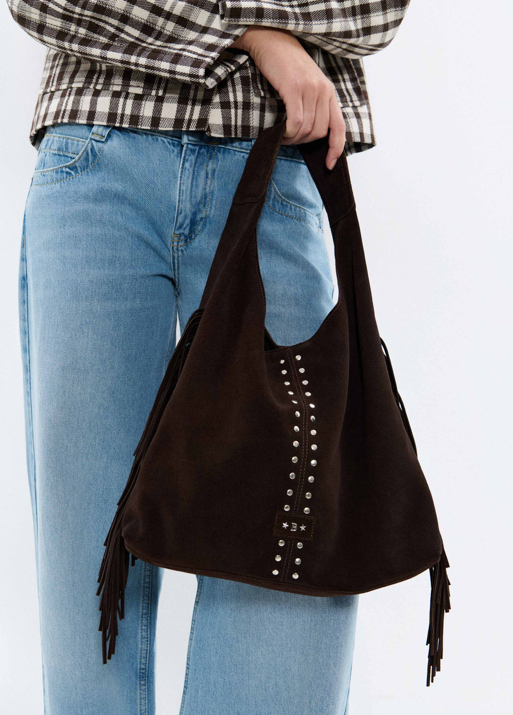 Leather shoulder bag with fringes