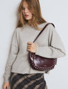 Bolso media luna tachas