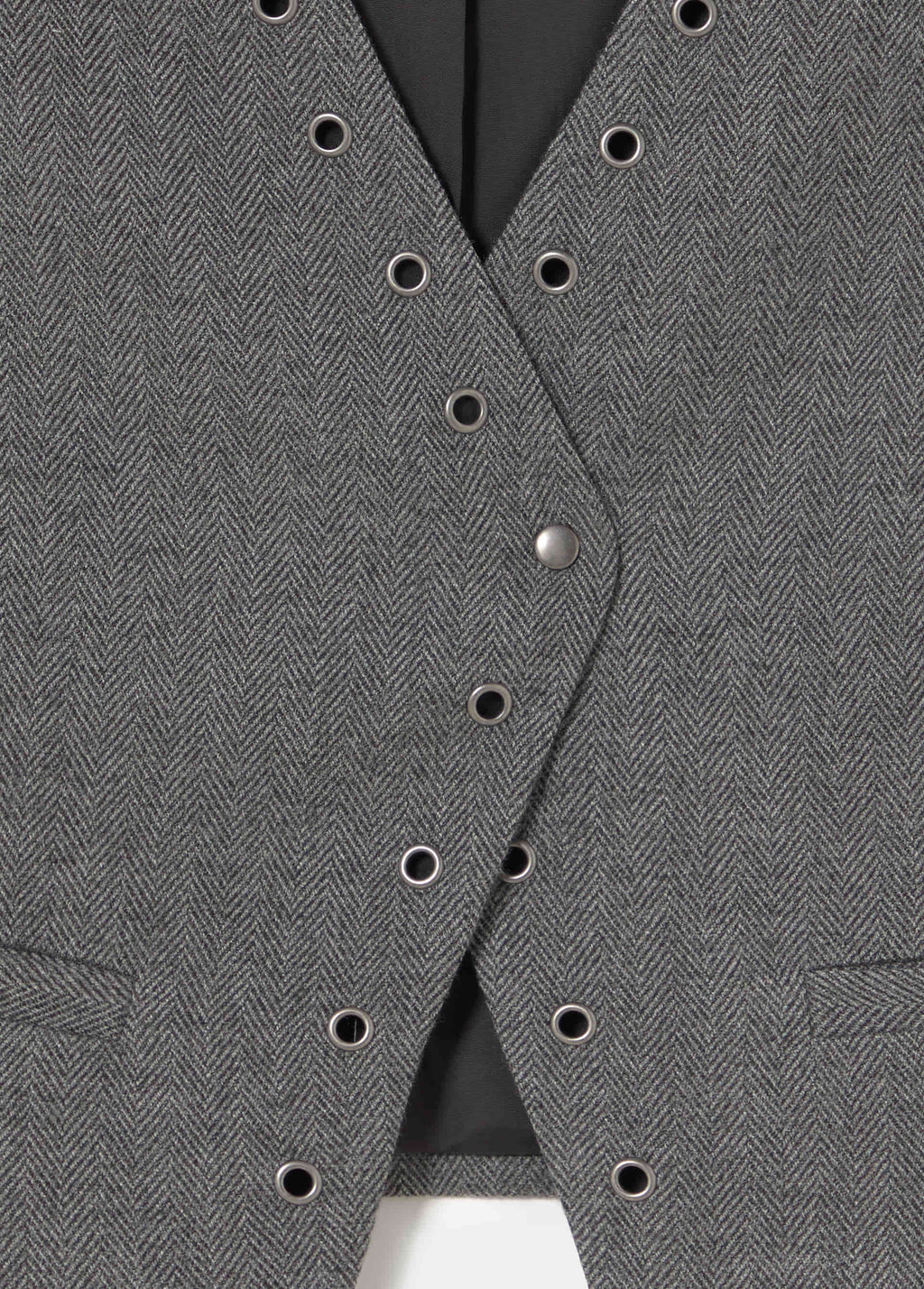 Crossed eyelet vest