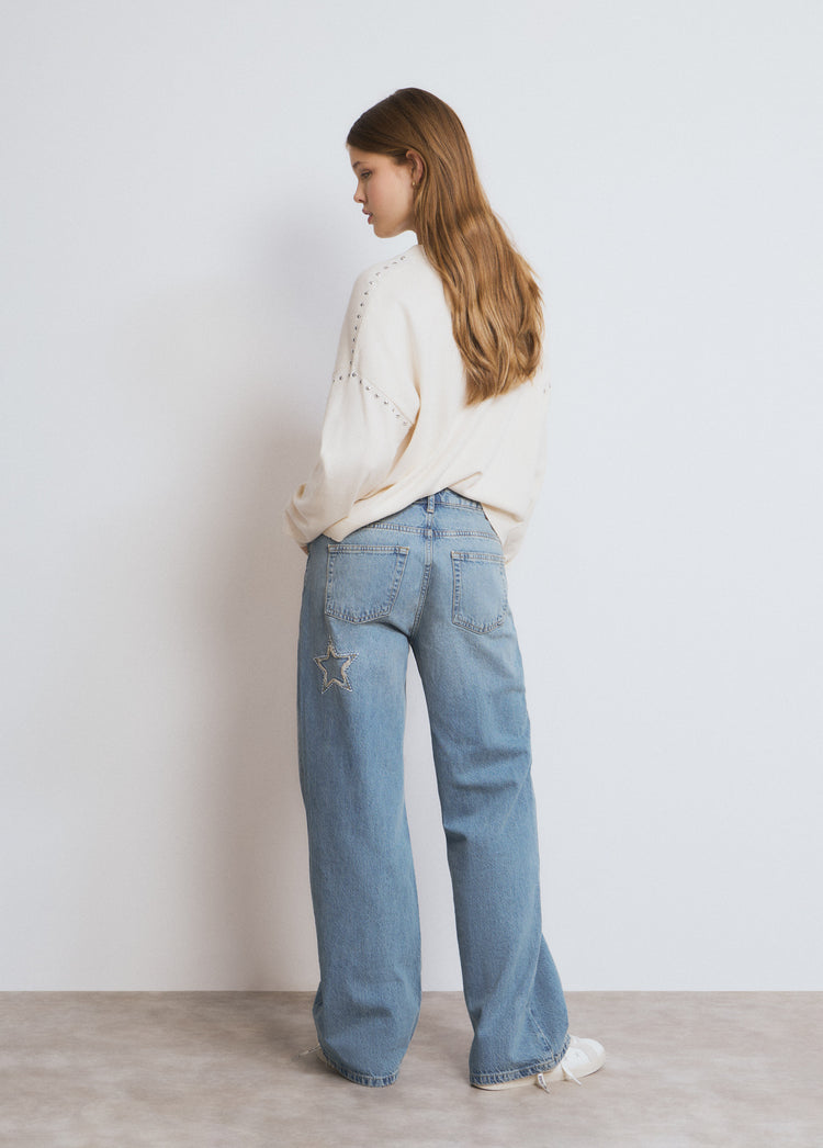 Jeans with star patch and frayed edges