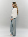 Jeans pieza lateral punto cruz