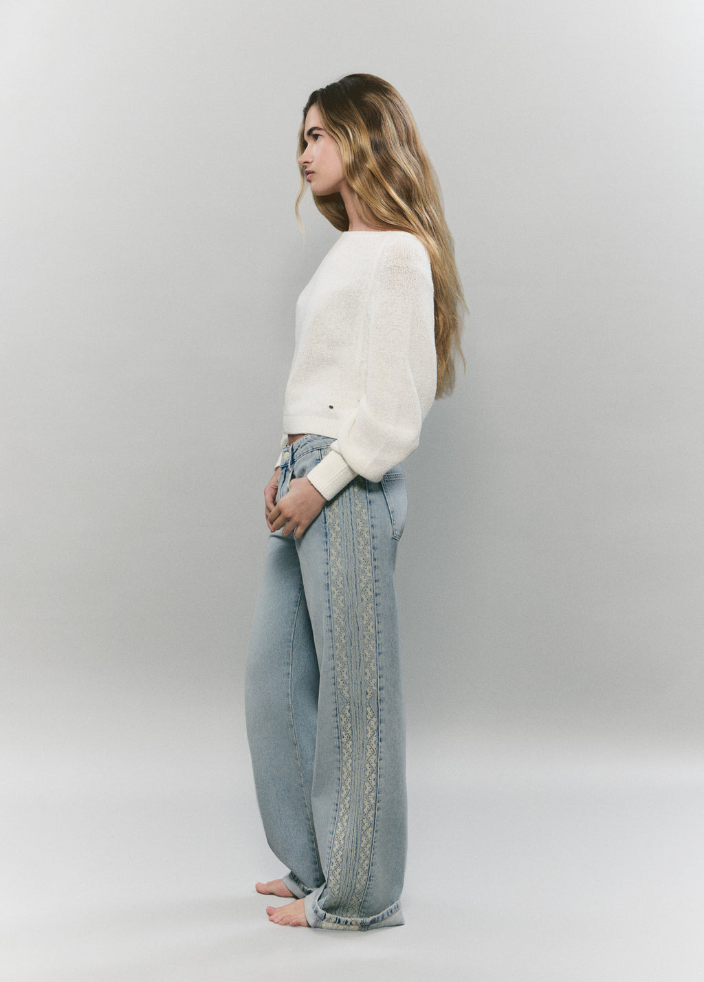 Jeans pieza lateral punto cruz