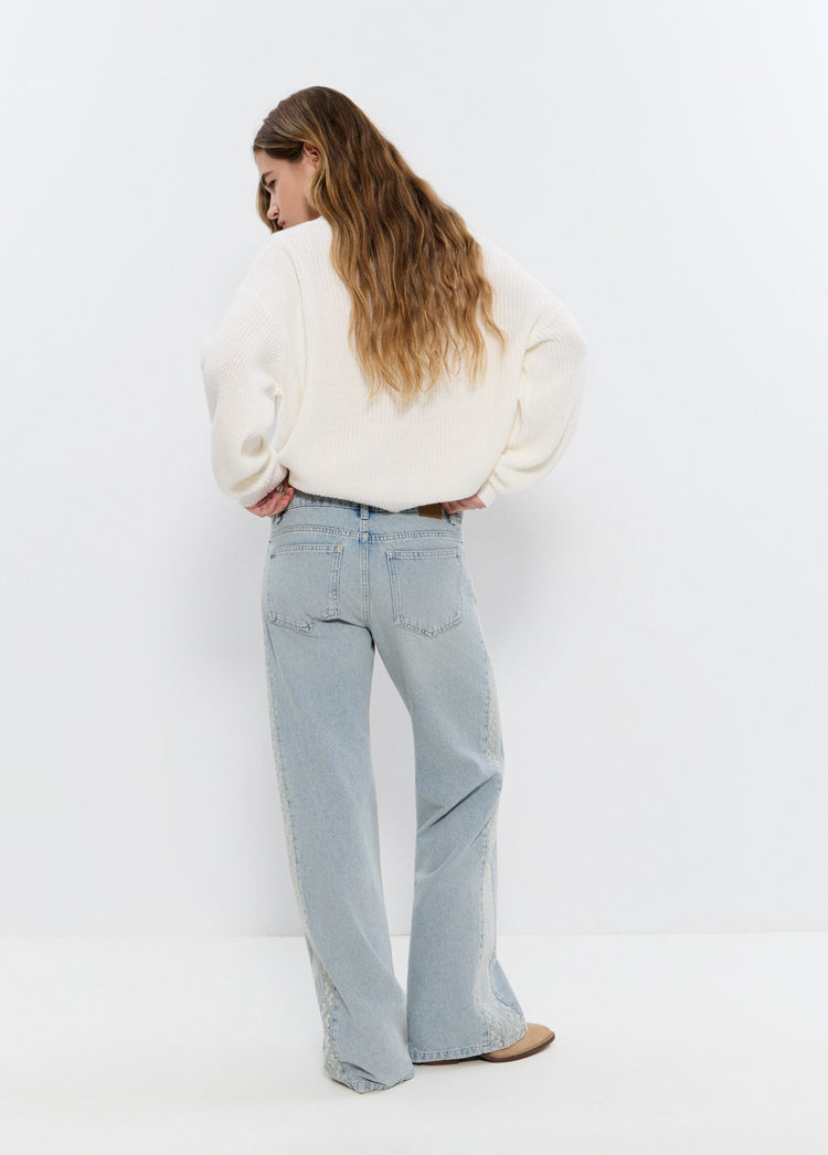 Jeans with side cross stitch panel