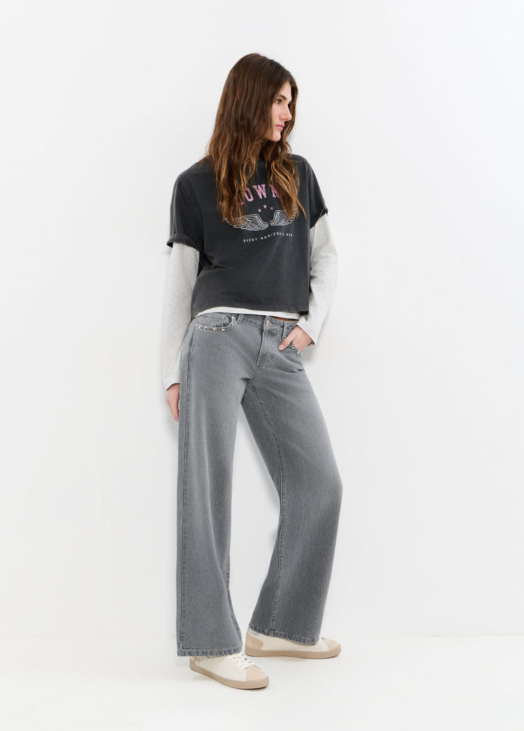 Low-rise jeans with embroidered wings and studs