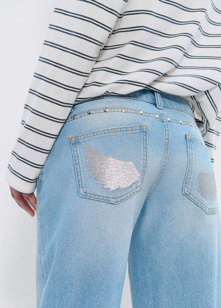 Low-rise jeans with glitter wings