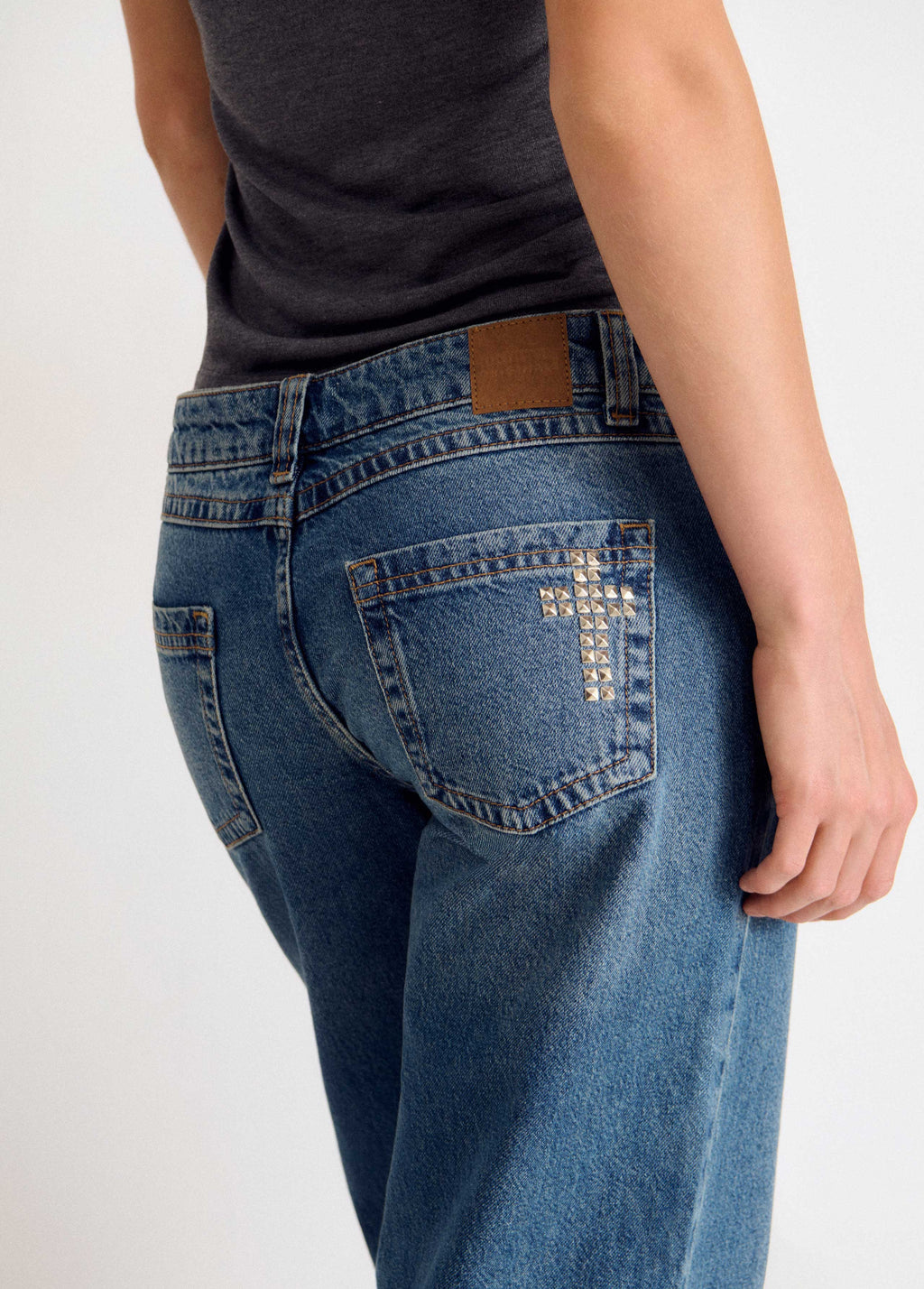 Jeans tachas cruz