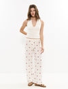 Pantalons llargs brodats amb cenefa