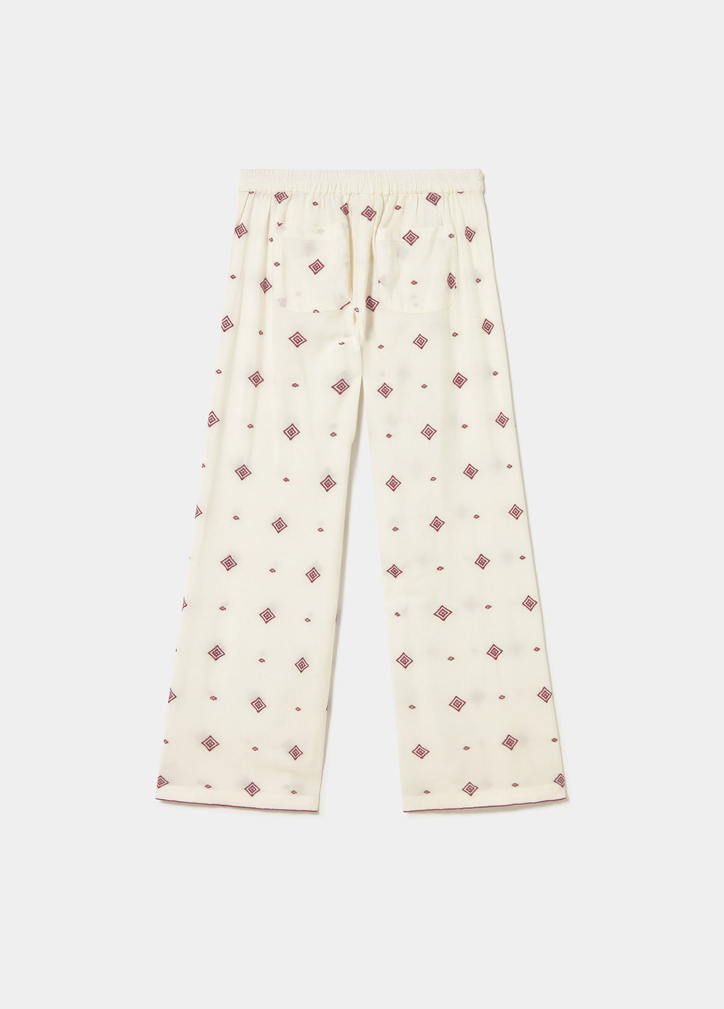 Pantalons llargs brodats amb cenefa