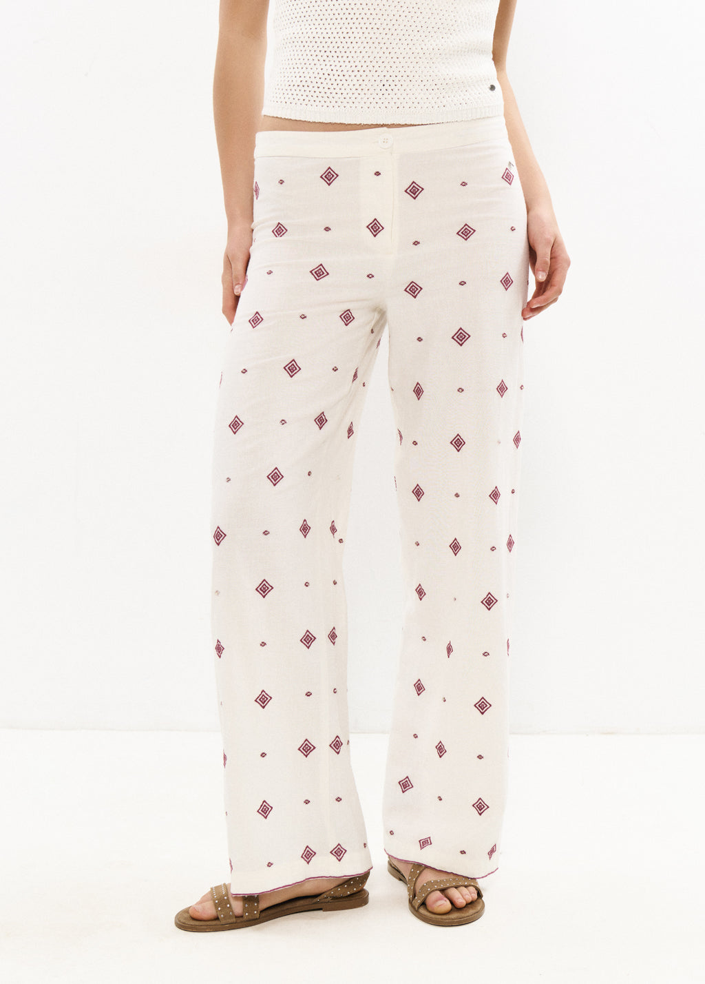 Pantalons llargs brodats amb cenefa
