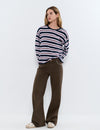 Pantalón relaxed tachuelas y bajo desdoblado