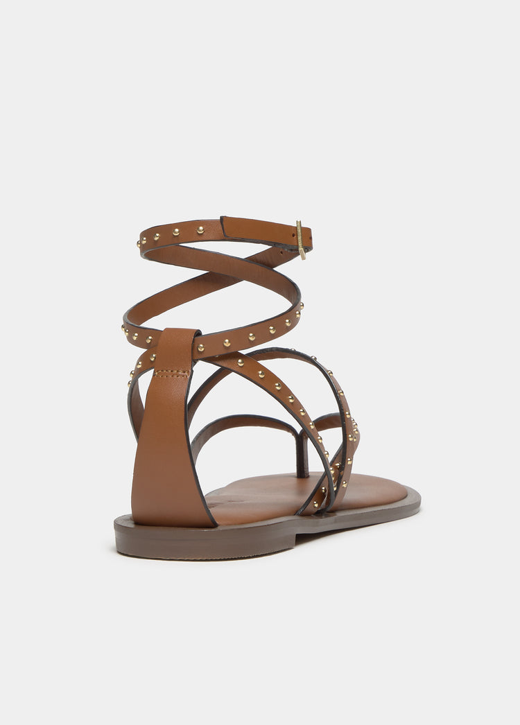 Flat sandal with studded straps