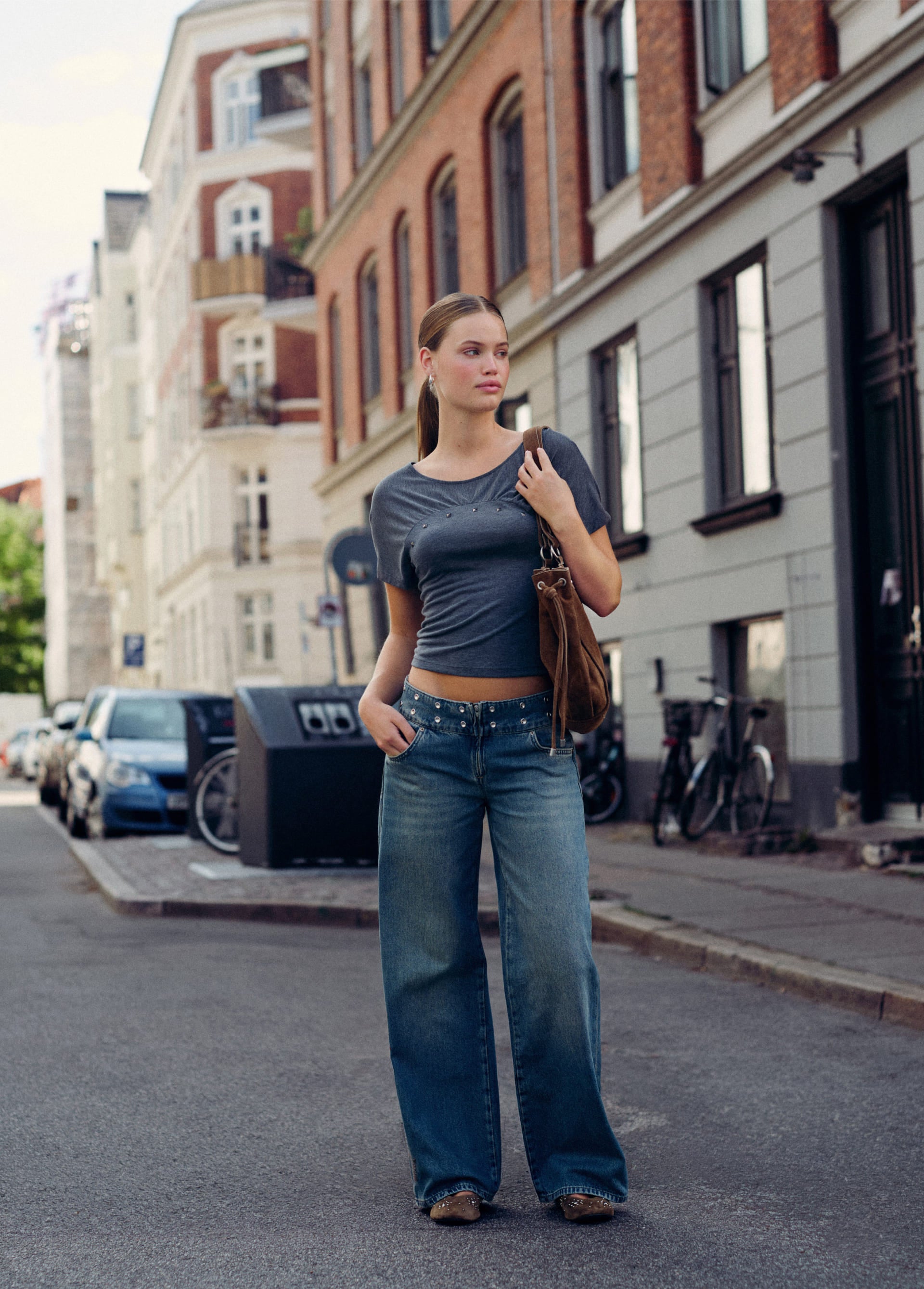 Jeans with studded waistband and embroidery