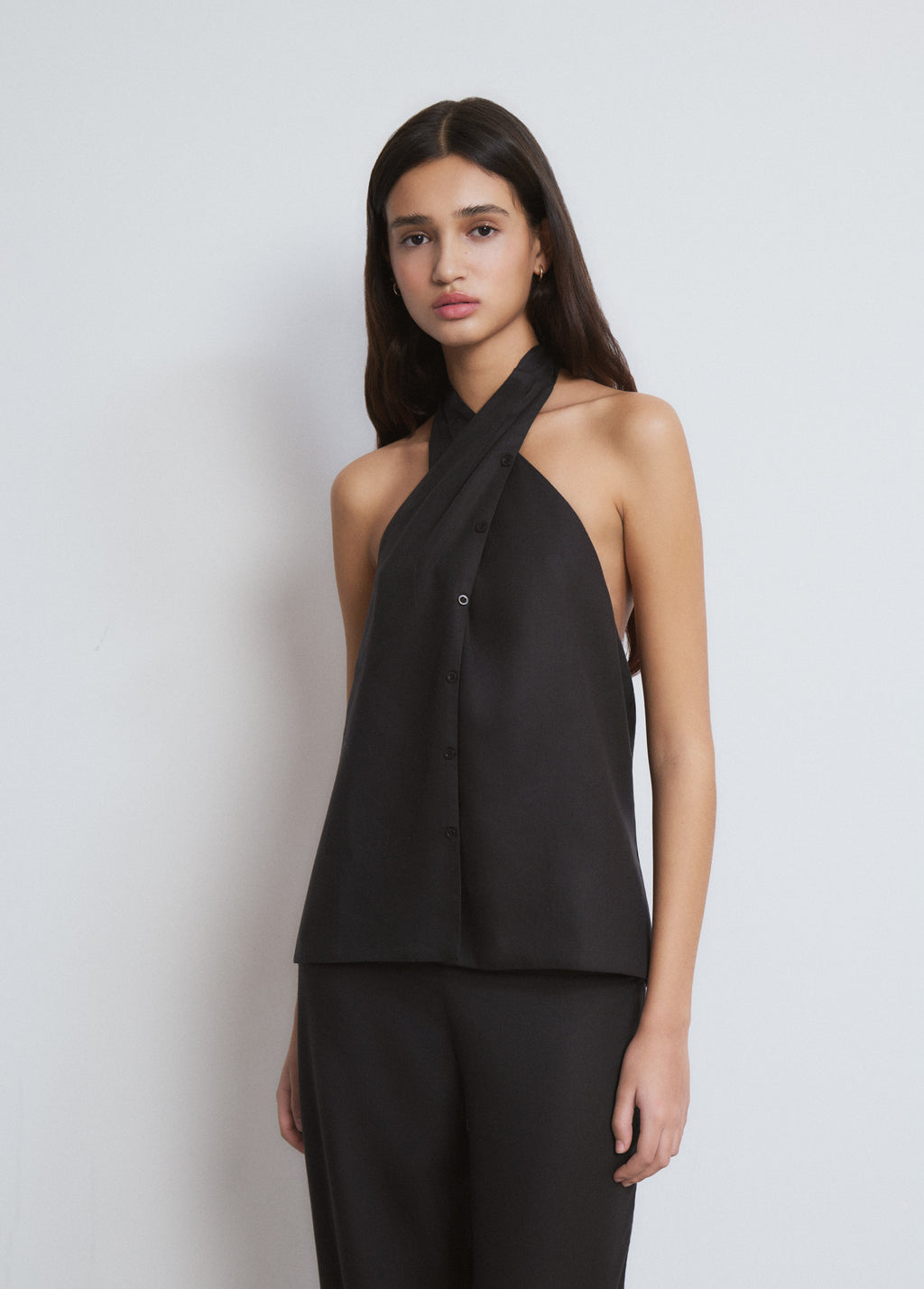 Top met geplooide knoopdetails