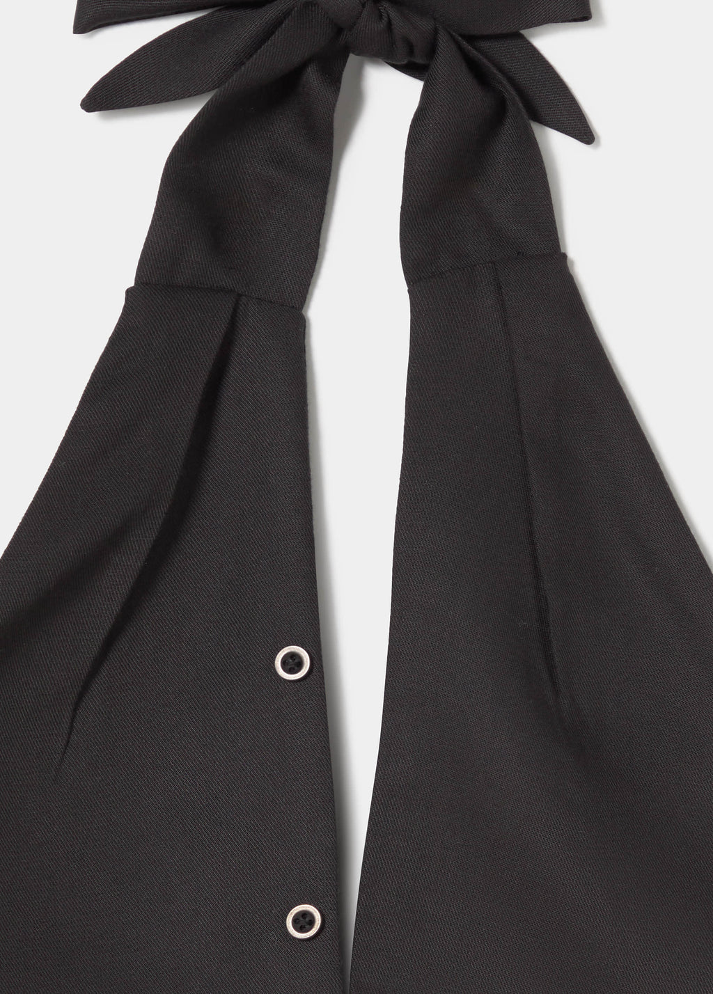 Top met geplooide knoopdetails